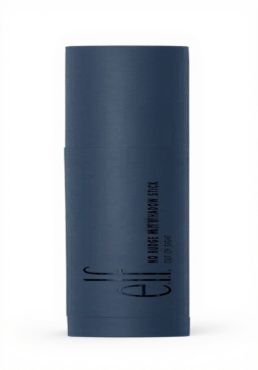Applying e.l.f. No Budge Matte Eyeshadow Stick on a makeup vanity with natural lighting